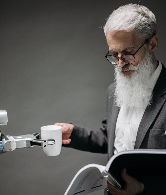 Reading Man Taking Coffee from a Robot